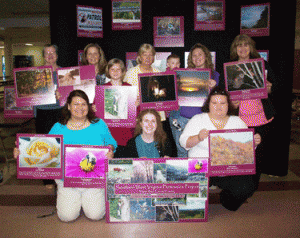 Pictured is Shannon Bell, front center, with the Harts Photovoice Group at their exhibit in Lincoln County, West Virginia, April 2009.