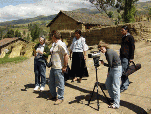 Professor Sharon Sherman shoots documentary footage on location in a small Andean village in Ecuador. Anthropologist Mabel Preloran is on the far left.