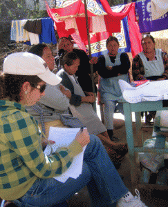 Pictured is a former graduate student doing research with microfinance clients in Bolivia.