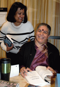 Pictured is Dr. Lamia Karim sharing a light moment with Dr. Vandana Shiva as Dr. Shiva signs books following the CSWS “Women’s Activism, Women’s Rights” Symposium.