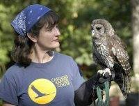 Pictured is Melissa Hart holding an owl.