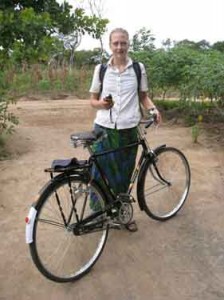 With GPS unit in hand, 2010 CSWS Jane Grant Dissertation Fellowship Awardee Ingrid L. Nelson is shown setting out on her bicycle to survey farmer’s fields for the day.